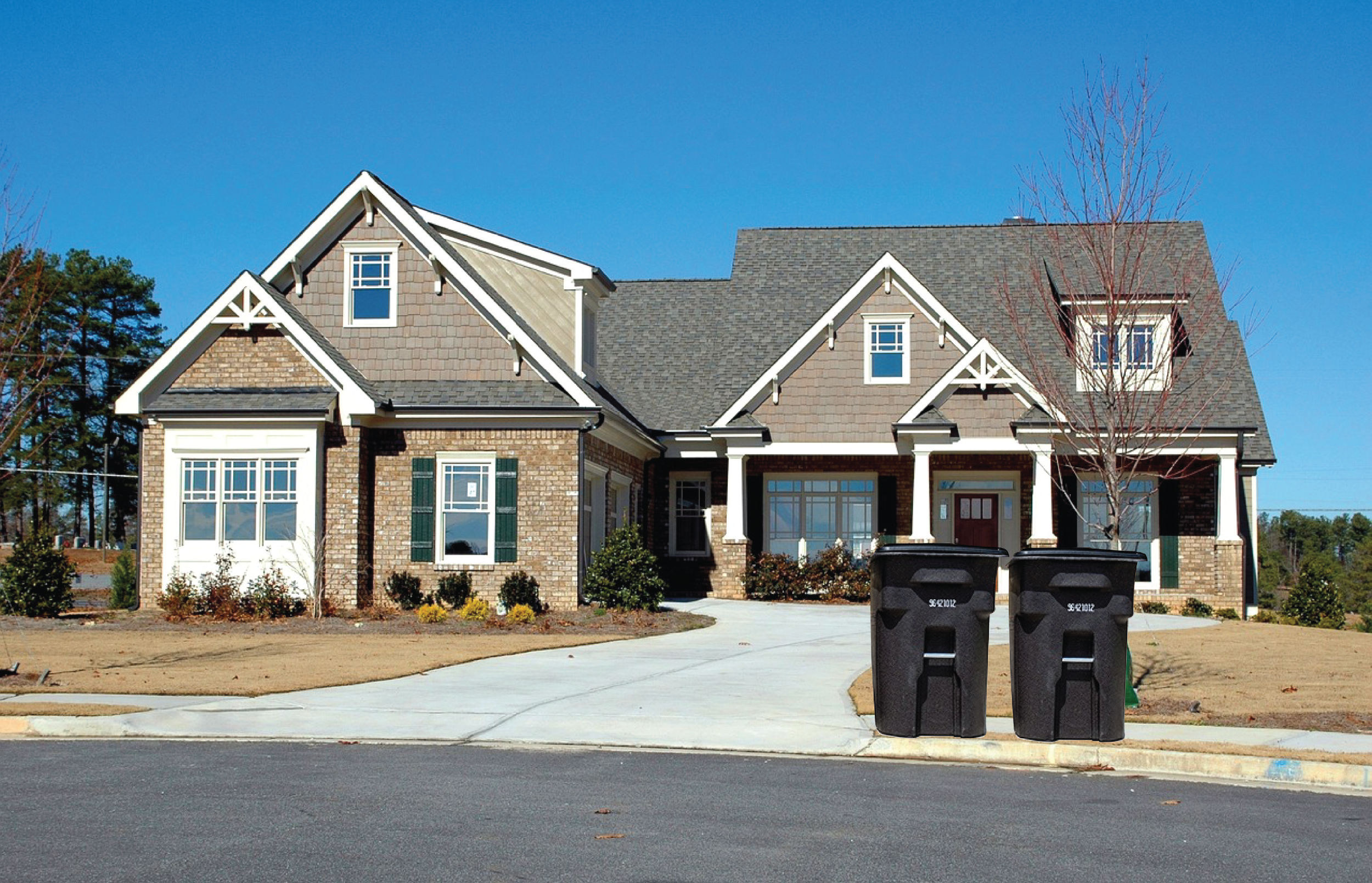 Desktop Home with trash bins at end of driveway